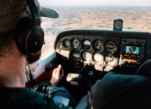 pilot-flying-aircraft-daytime_181624-17494